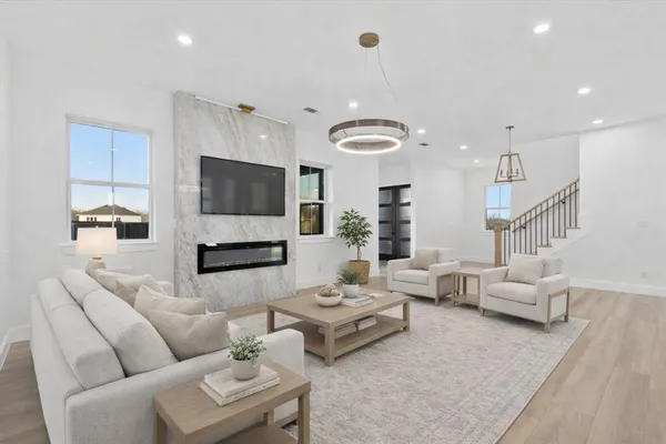 a living room with furniture and a flat screen tv