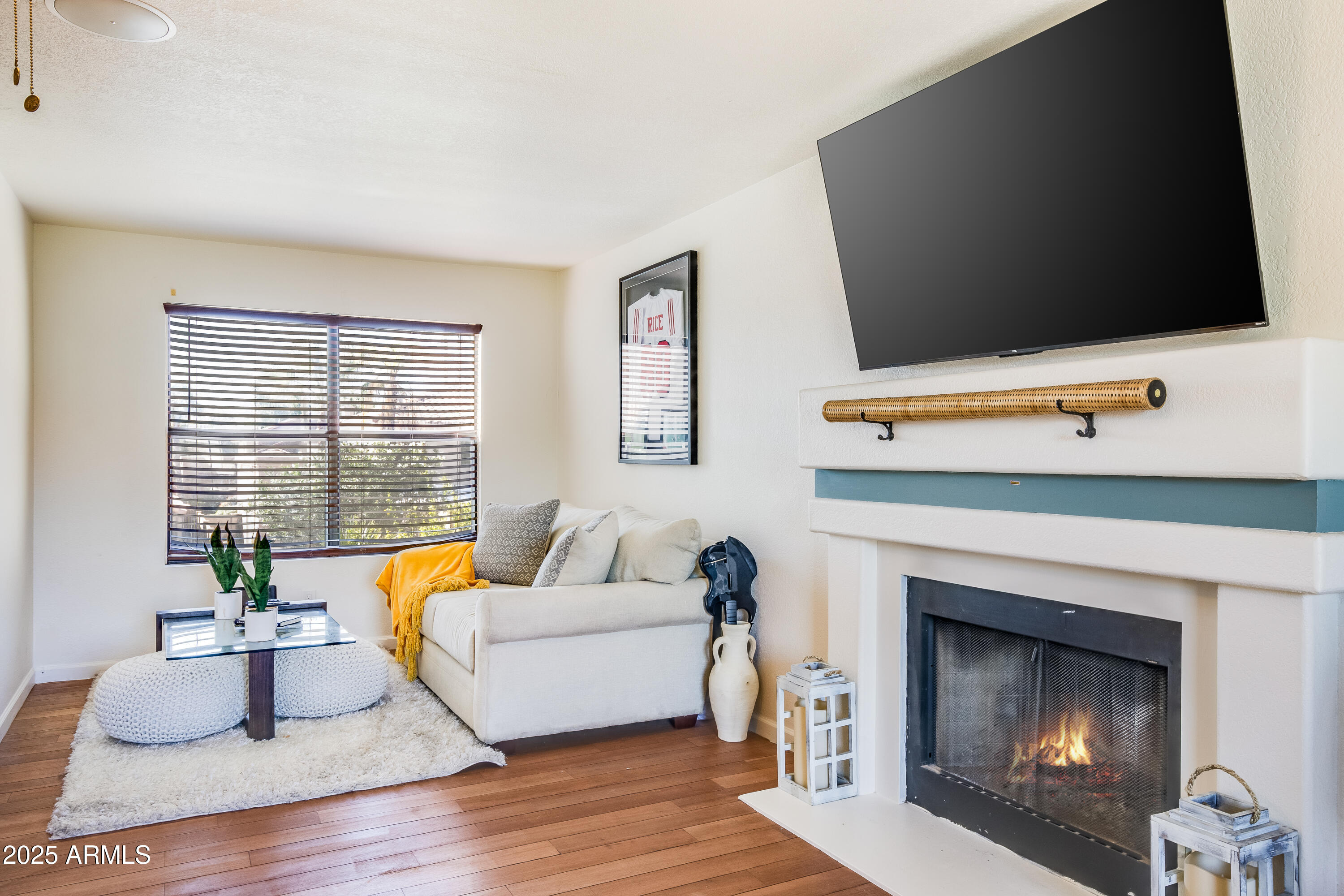 7383 West Utopia Road Glendale, AZ 85308 - Photo 13 of 18 a living room with furniture and a fireplace