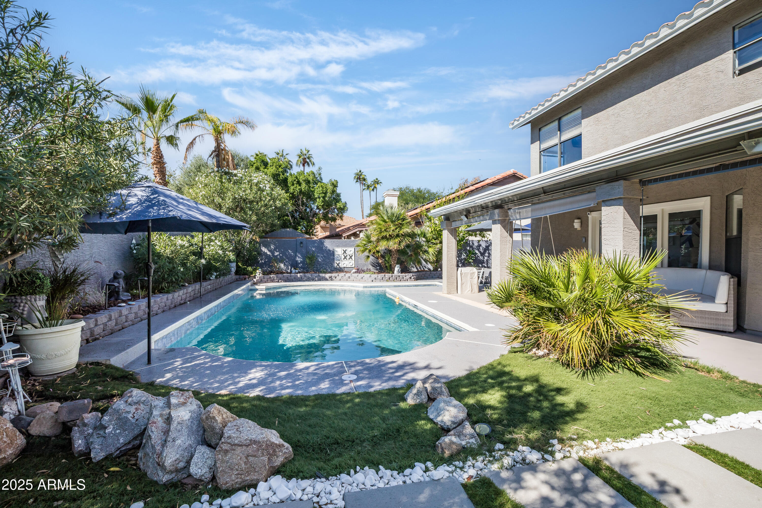 7383 West Utopia Road Glendale, AZ 85308 - Photo 18 of 18 a front view of a house with garden