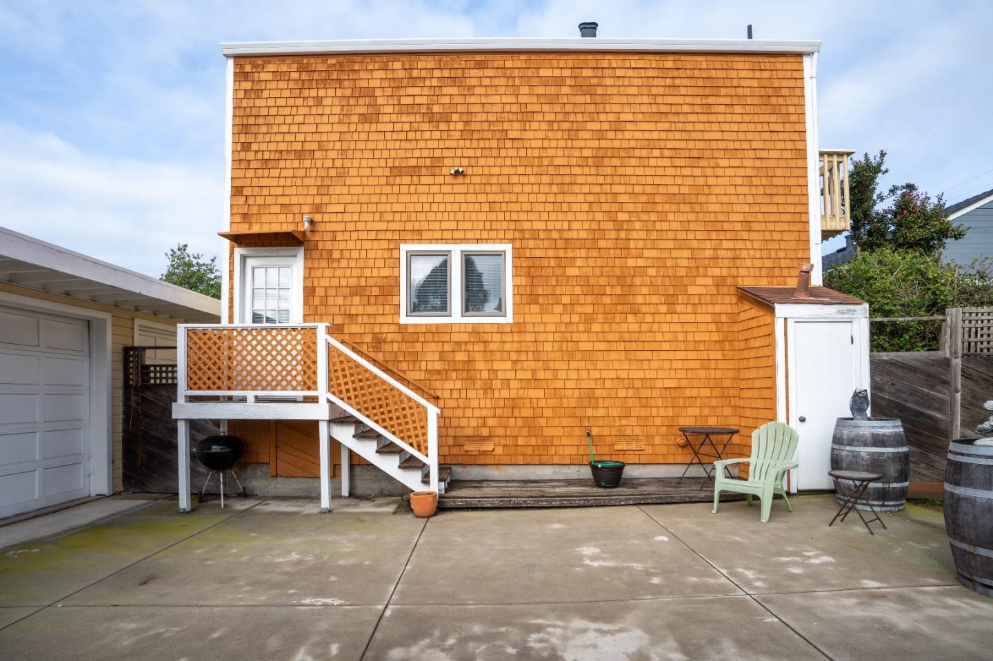 280 Brighton Road Pacifica, CA 94044 - Photo 2 of 12 a view of a patio with table and chairs