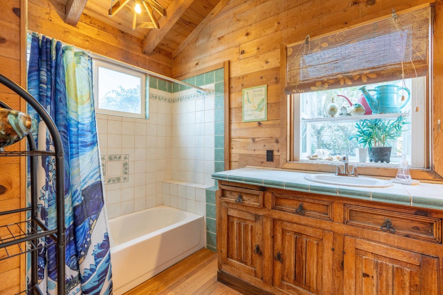 280 Brighton Road Pacifica, CA 94044 - Photo 8 of 12 a bathroom with a bathtub and a sink