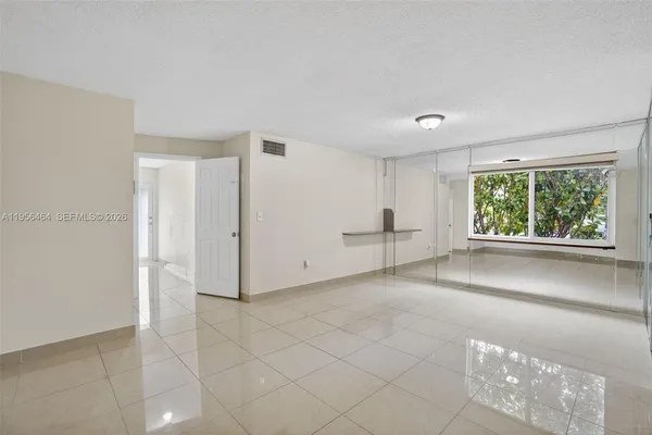 a view of an empty room with a window