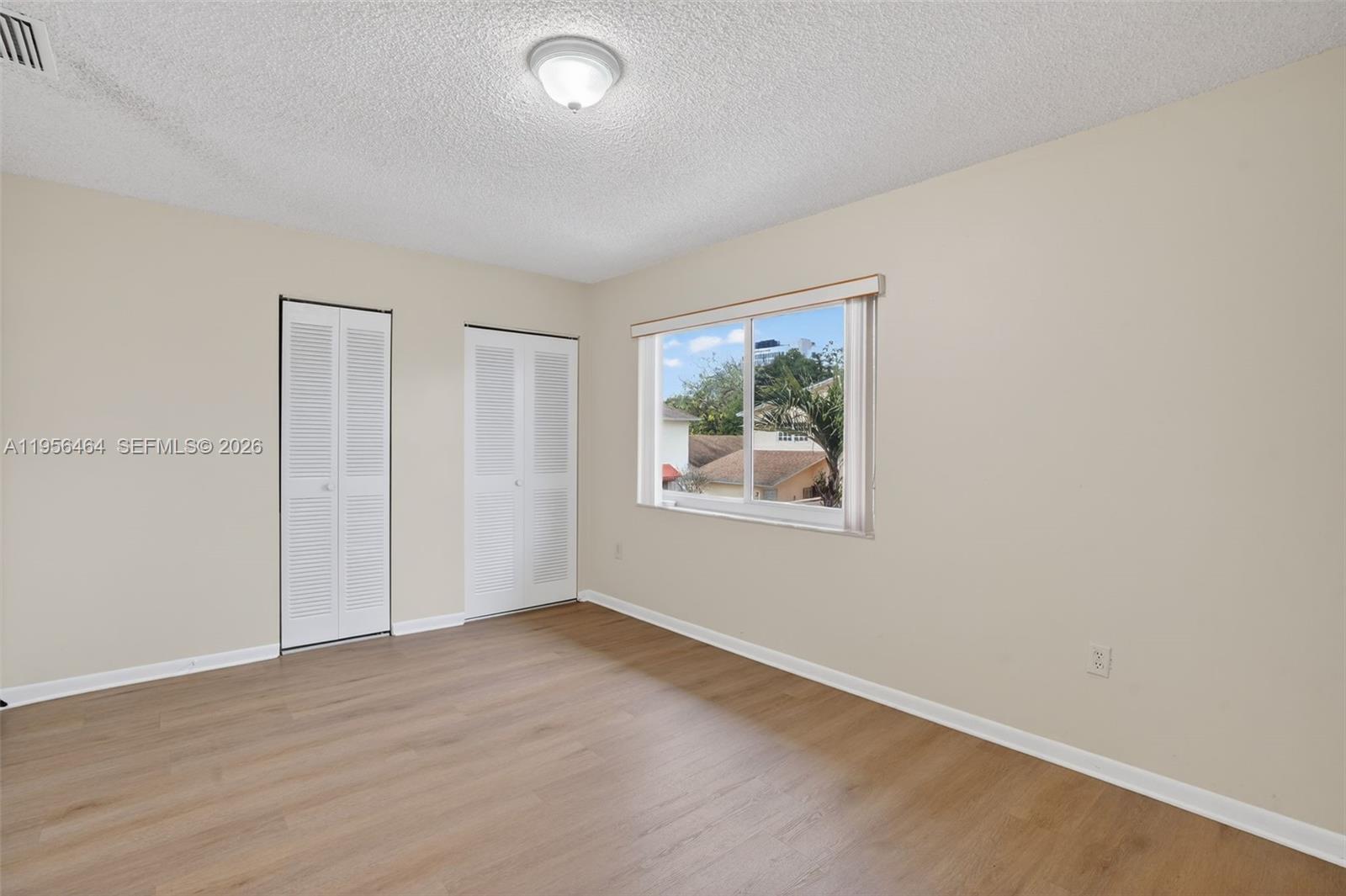 2455 Southwest 11th Street, Unit 7A Miami, FL 33135 - Photo 20 of 38 an empty room with a window