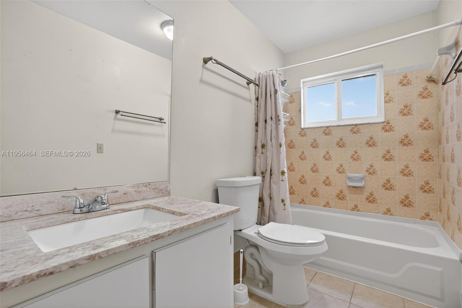 2455 Southwest 11th Street, Unit 7A Miami, FL 33135 - Photo 21 of 38 a bathroom with a granite countertop sink toilet and shower