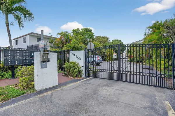 a view of a wrought iron fences in front of house