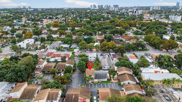 an aerial view of residential houses with outdoor space