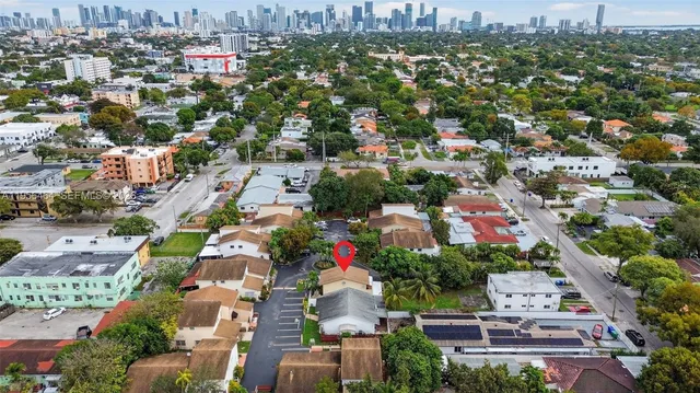 an aerial view of residential houses with outdoor space