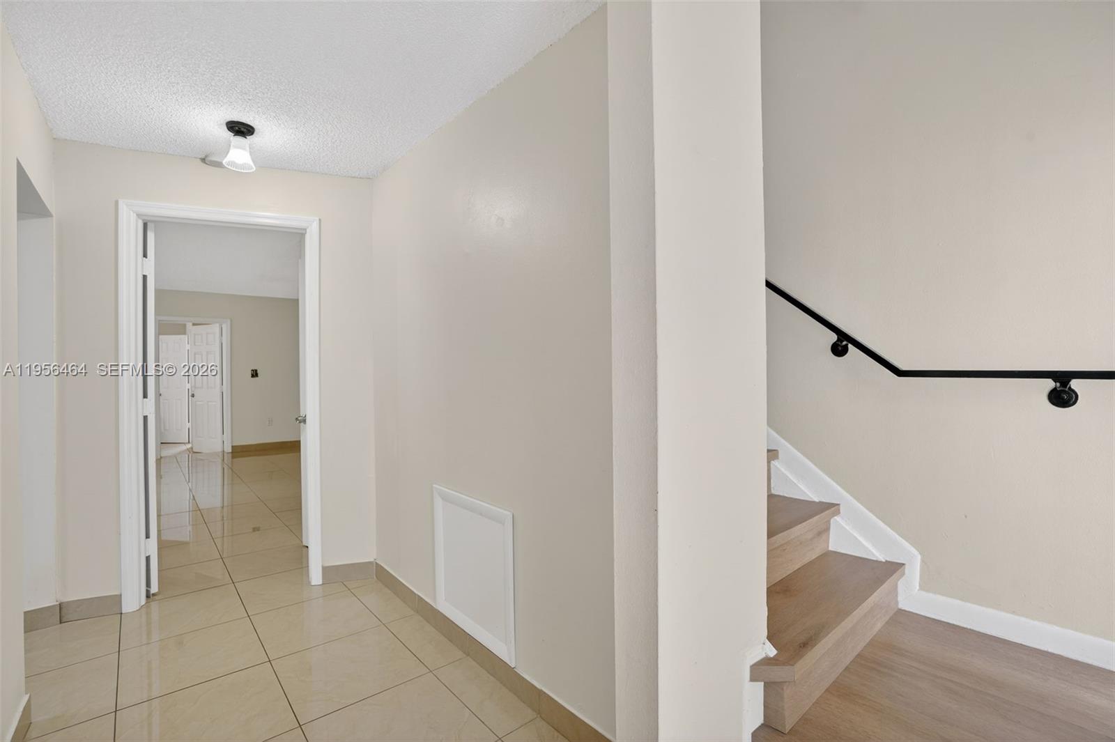 2455 Southwest 11th Street, Unit 7A Miami, FL 33135 - Photo 6 of 38 a view of an entryway with staircase