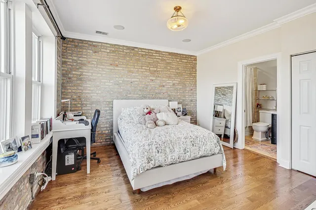 a bedroom with a bed and a table