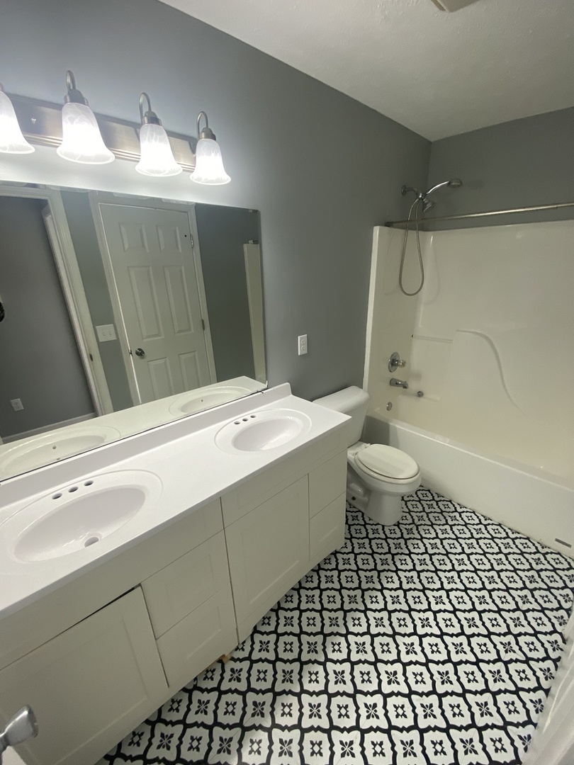 250 Parktrail Road Normal, IL 61761 - Photo 12 of 16 a bathroom with a sink a toilet a mirror and shower