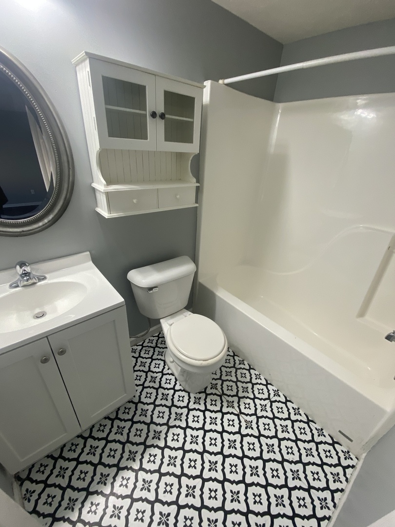 250 Parktrail Road Normal, IL 61761 - Photo 16 of 16 a bathroom with a sink toilet and a mirror