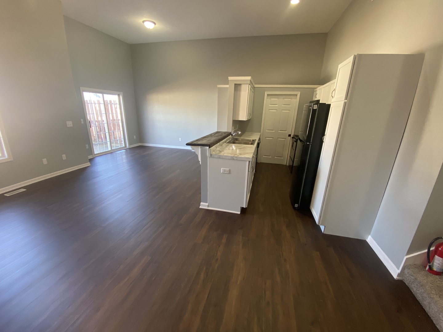 250 Parktrail Road Normal, IL 61761 - Photo 5 of 16 a view of a refrigerator in kitchen and wooden floor