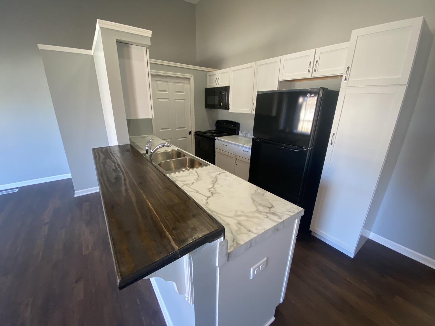250 Parktrail Road Normal, IL 61761 - Photo 6 of 16 a kitchen with stainless steel appliances wooden floors and refrigerator