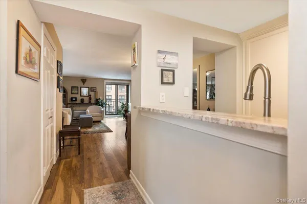 a view of a living room and hardwood floor