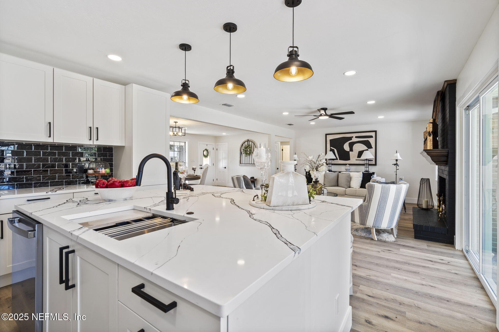 3715 Rustic Lane Jacksonville, FL 32217 - Photo 14 of 45 a view of kitchen a sink and living room with a chandelier