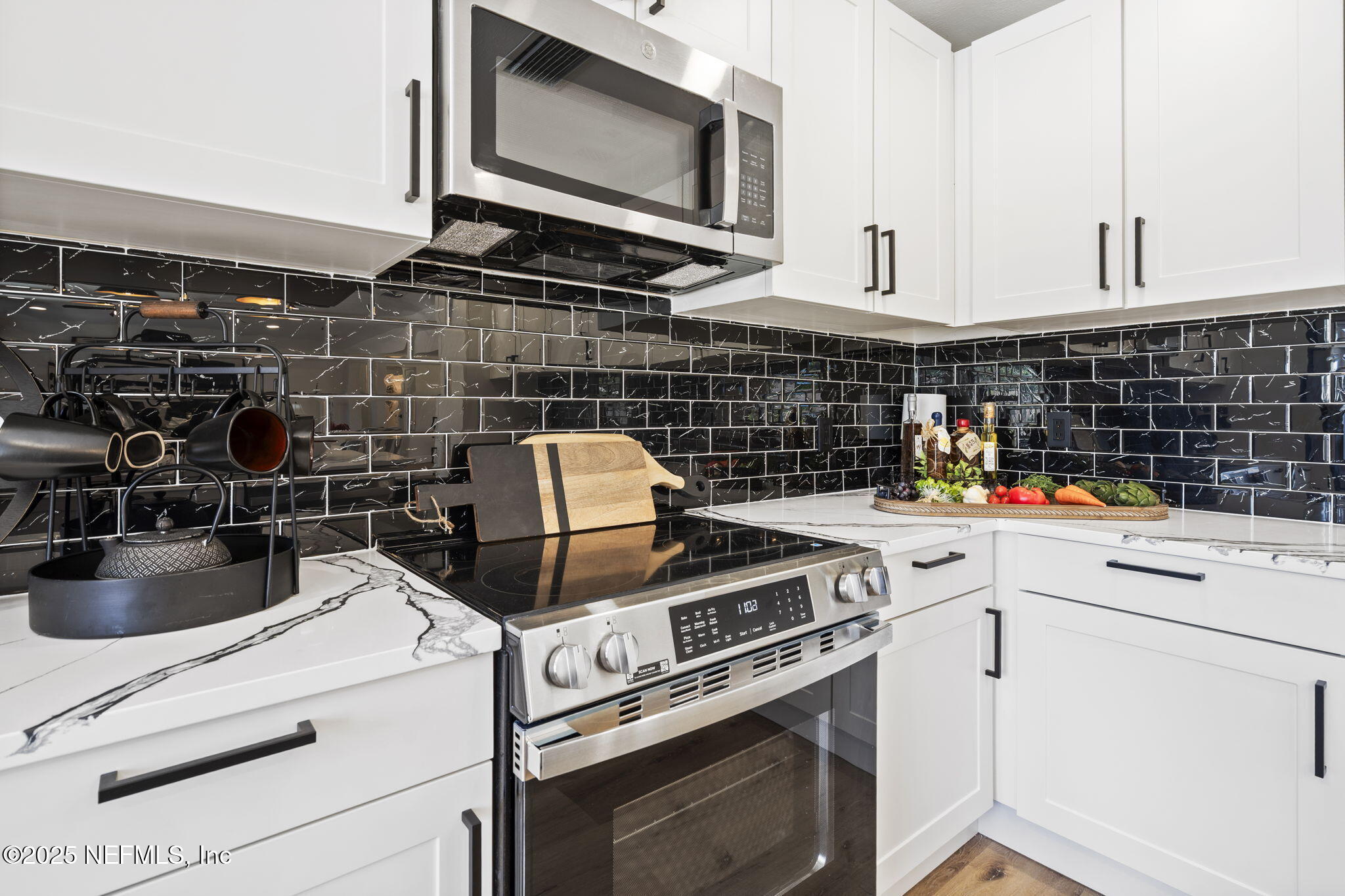 3715 Rustic Lane Jacksonville, FL 32217 - Photo 15 of 45 a kitchen with a stove and a microwave