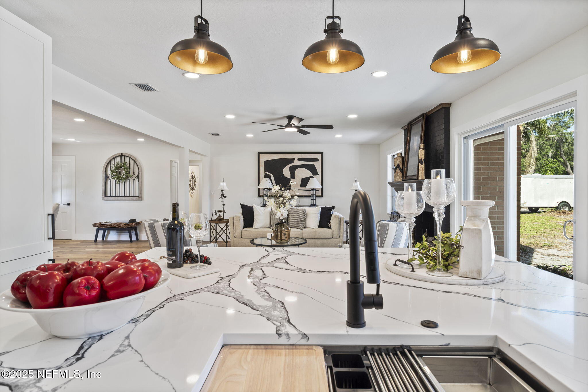 3715 Rustic Lane Jacksonville, FL 32217 - Photo 16 of 45 a bedroom with a bed and a chandelier