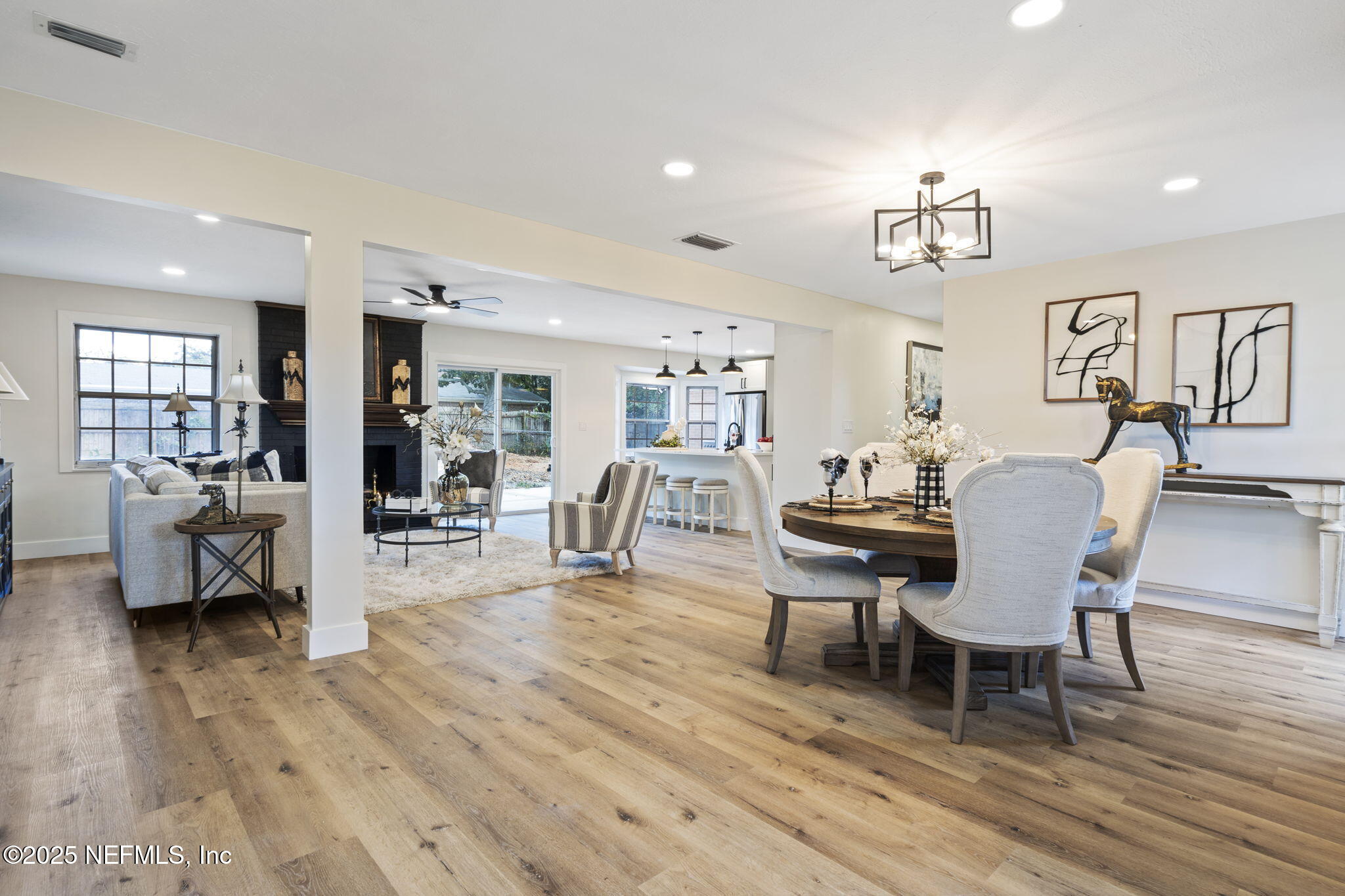 3715 Rustic Lane Jacksonville, FL 32217 - Photo 19 of 45 a view of a dining room with furniture and wooden floor