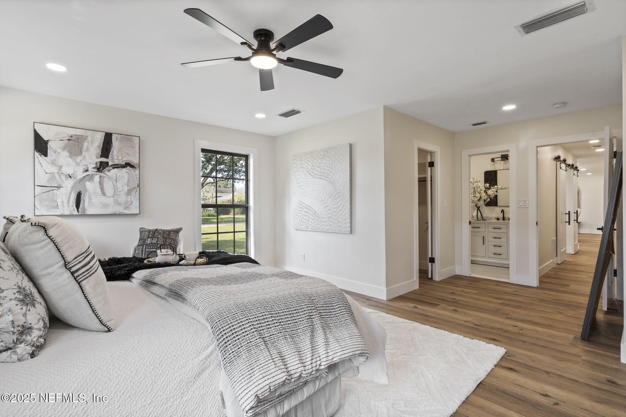 3715 Rustic Lane Jacksonville, FL 32217 - Photo 27 of 45 a spacious bedroom with a bed and a window