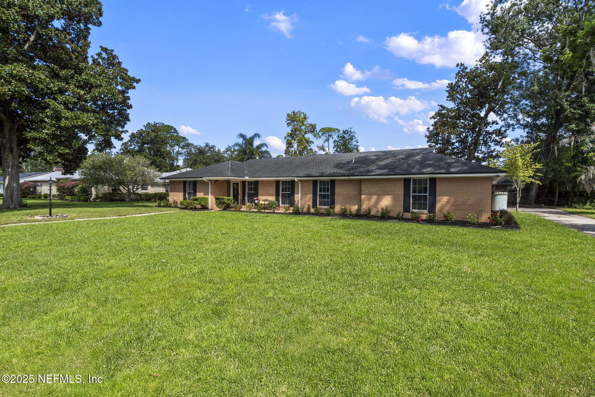 3715 Rustic Lane Jacksonville, FL 32217 - Photo 38 of 45 a front view of a house with a garden and porch