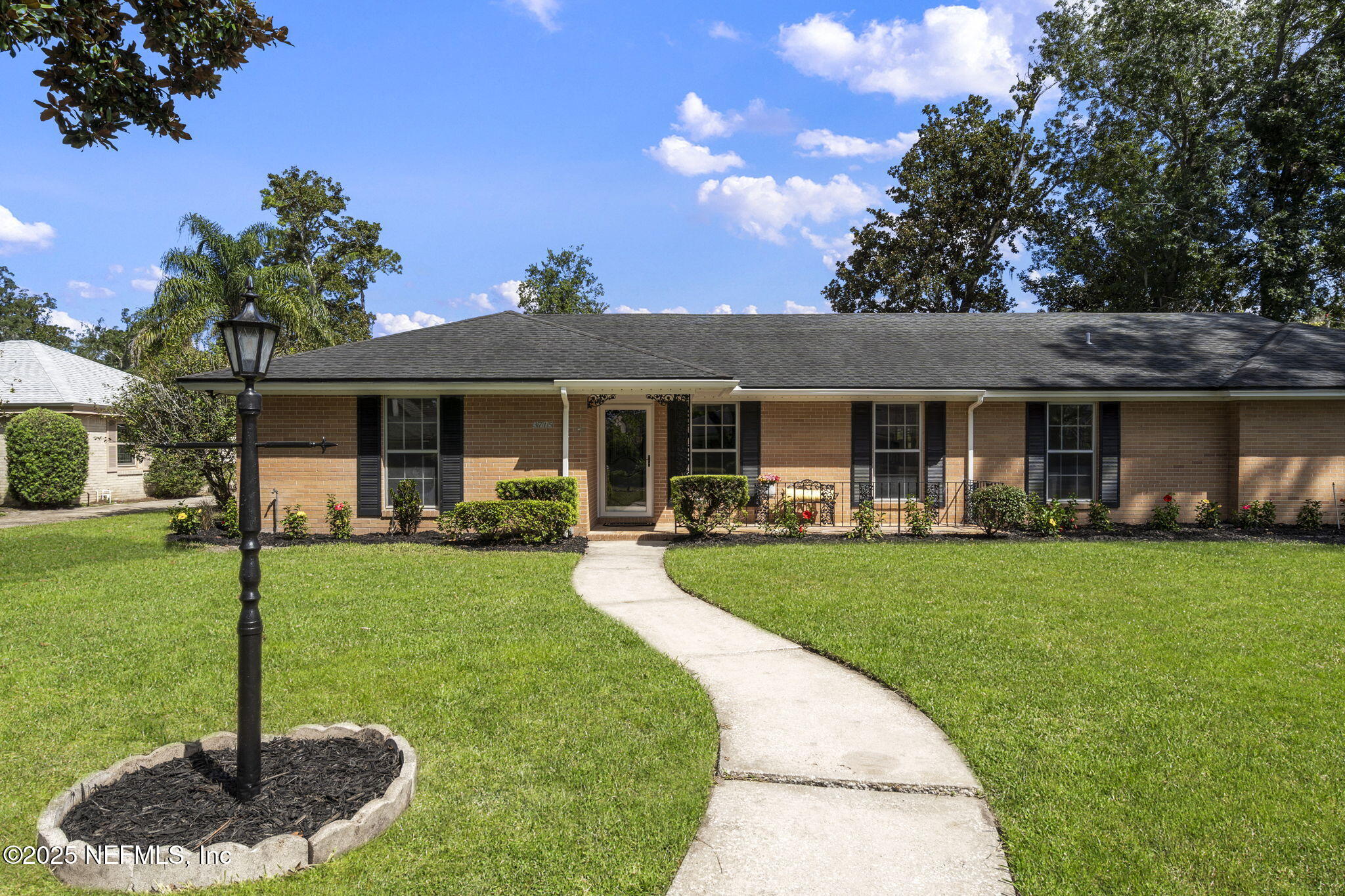 3715 Rustic Lane Jacksonville, FL 32217 - Photo 39 of 45 a front view of a house with swimming pool having outdoor seating