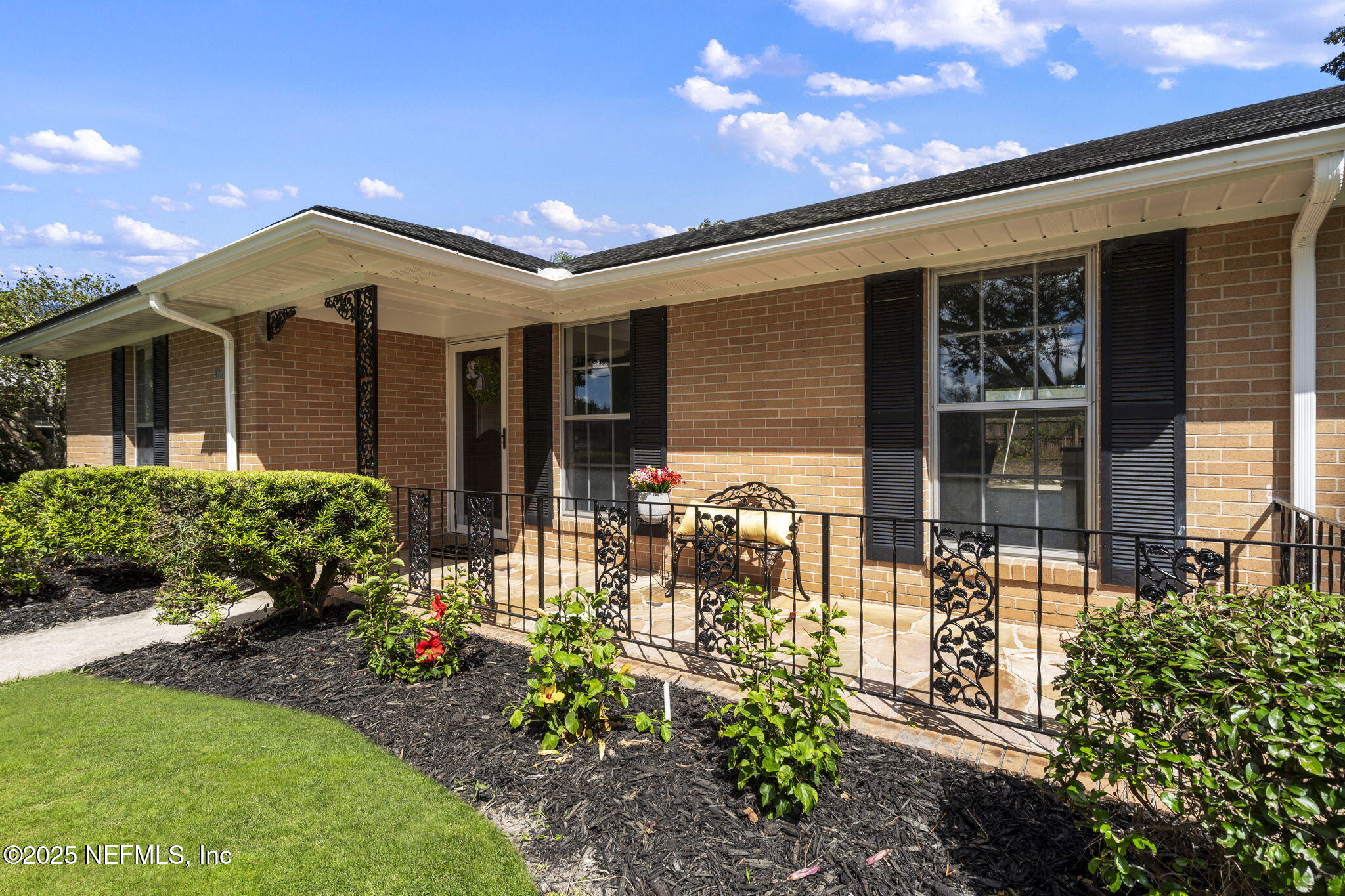 3715 Rustic Lane Jacksonville, FL 32217 - Photo 40 of 45 a view of a porch with a table and chairs