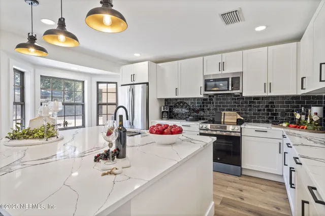 a bathroom with a toilet sink and shower