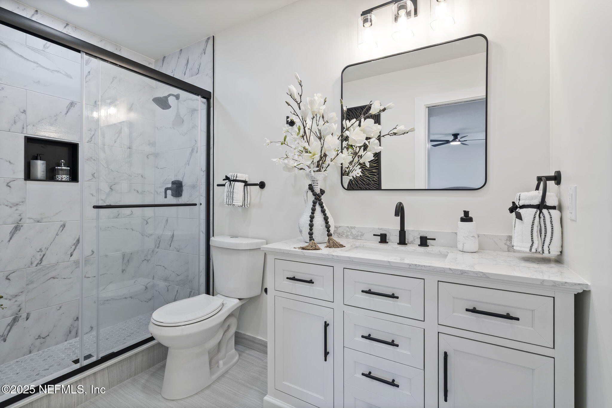 3715 Rustic Lane Jacksonville, FL 32217 - Photo 5 of 45 a bathroom with a toilet sink and shower