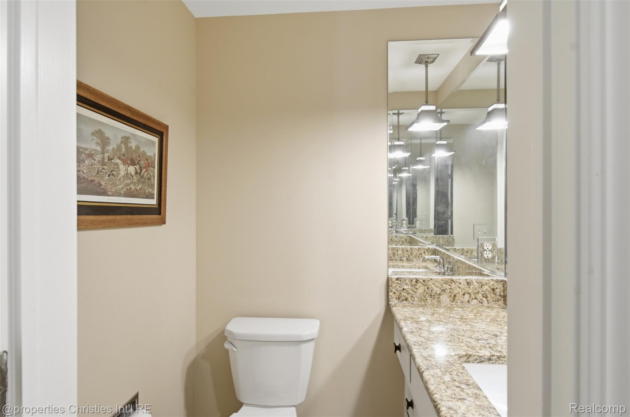 25235 Canterbury Road Franklin, MI 48025 - Photo 35 of 56 Bedroom 4 powder room featuring a light-colored vanity with a granite countertop, undermount sink, and white cabinetry