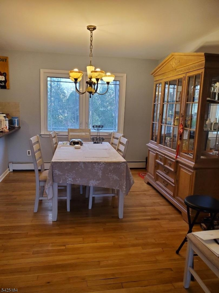 74 East McClellan Avenue Livingston, NJ 07039 - Photo 3 of 7 a view of a dining room with furniture window and wooden floor