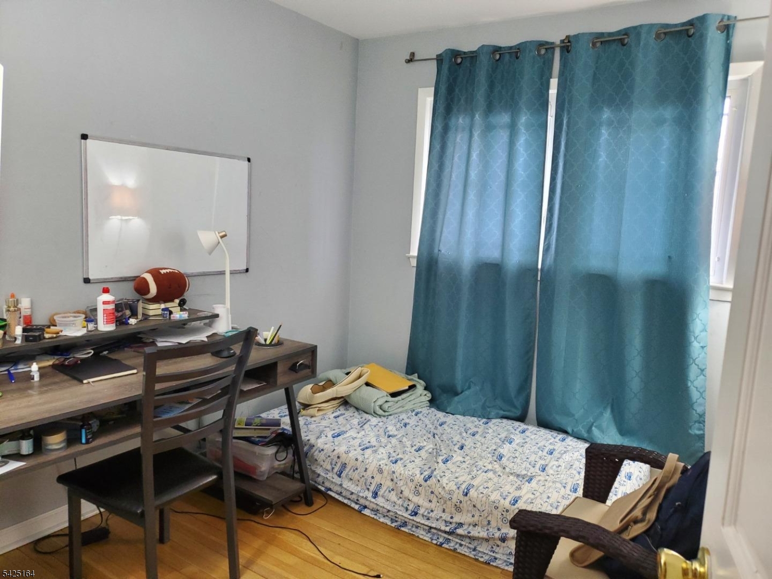 74 East McClellan Avenue Livingston, NJ 07039 - Photo 5 of 7 a bedroom with a bed and a table in it