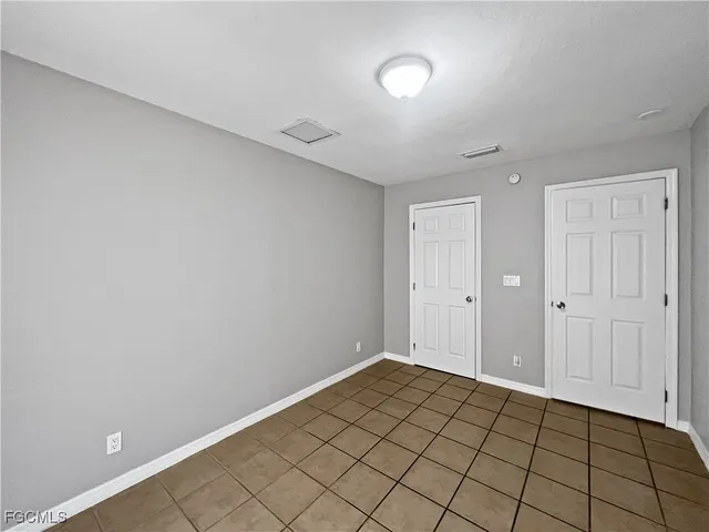 a view of an empty room and window