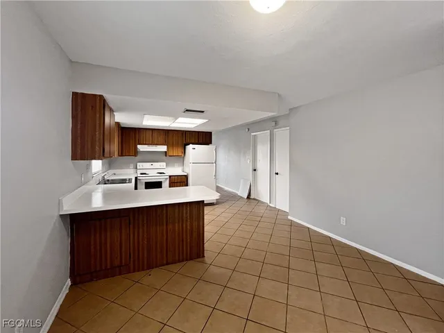 a room with a sink and cabinets