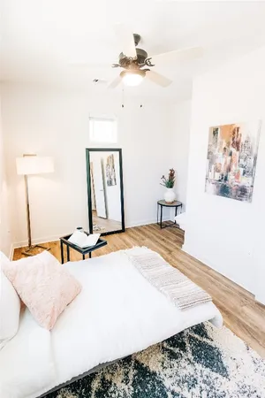 a bathroom with a granite countertop toilet a sink and a bathtub