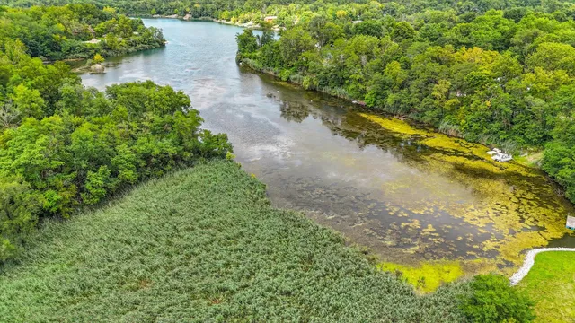 a view of a lake with a yard