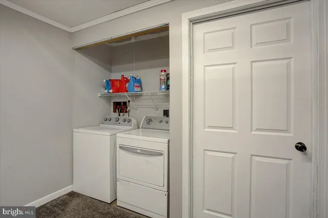 a view of a house with wooden fence