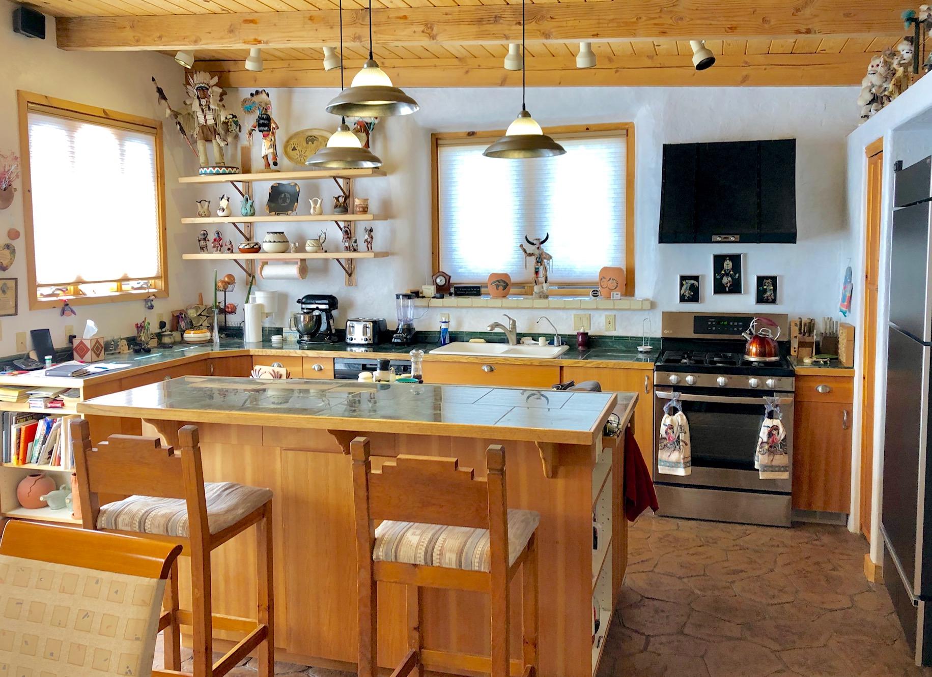 29050 30.90 Road Nucla, CO 81424 - Photo 10 of 25 a kitchen with stainless steel appliances kitchen island granite countertop a sink and cabinets