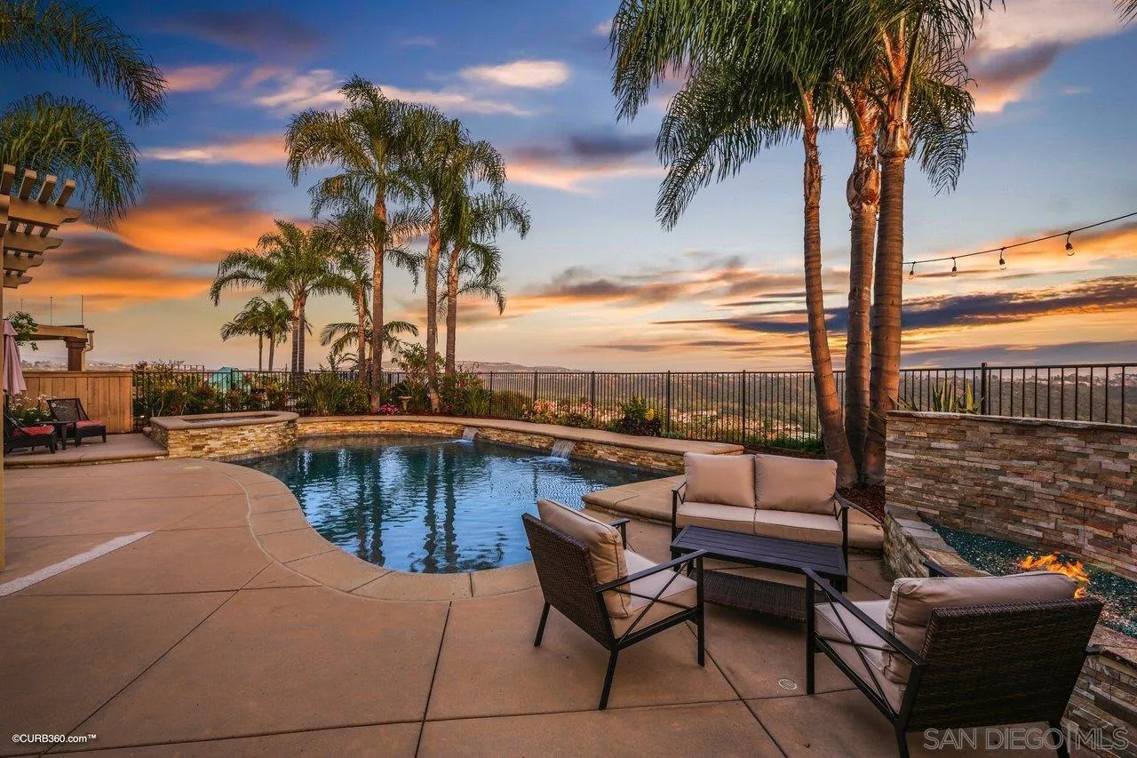 12504 Eclipse Place San Diego, CA 92129 - Photo 2 of 60 a balcony with outdoor seating and city view