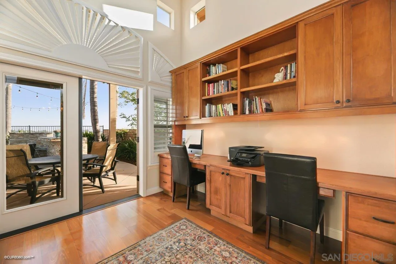 12504 Eclipse Place San Diego, CA 92129 - Photo 21 of 60 a kitchen with stainless steel appliances granite countertop a stove and a refrigerator