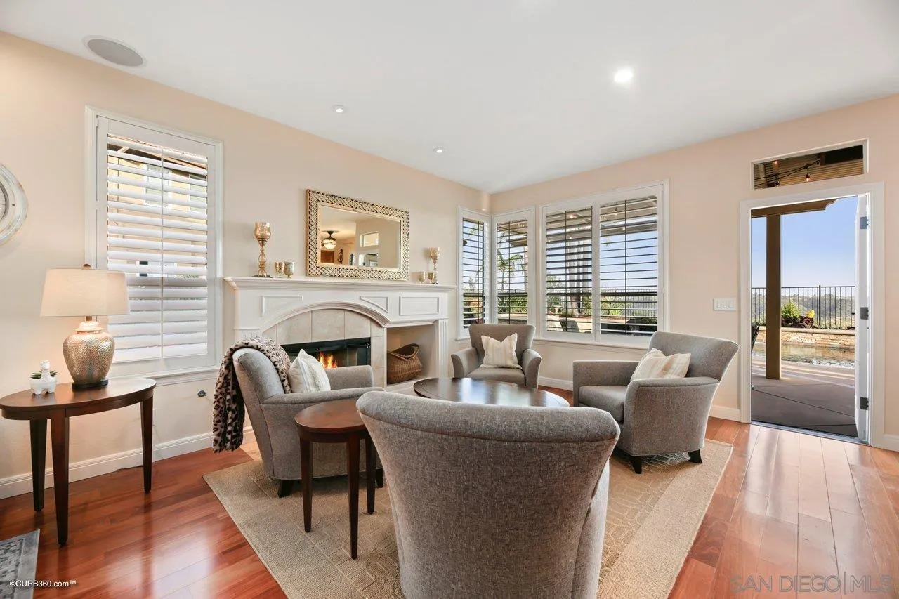12504 Eclipse Place San Diego, CA 92129 - Photo 27 of 60 a living room with furniture and a fireplace