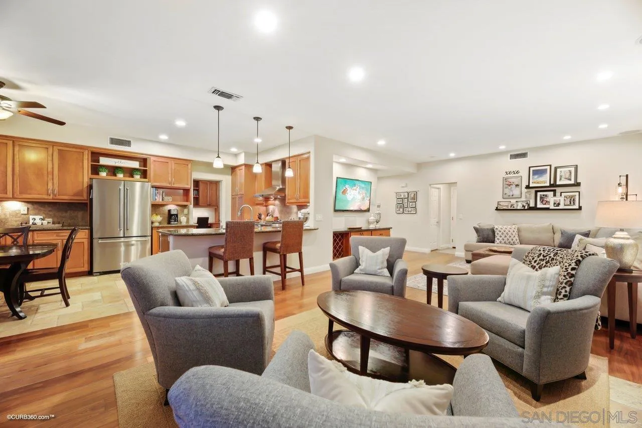 12504 Eclipse Place San Diego, CA 92129 - Photo 29 of 60 a living room with furniture kitchen view and a chandelier