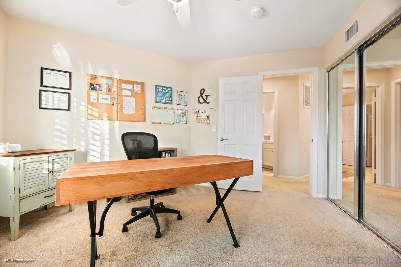 12504 Eclipse Place San Diego, CA 92129 - Photo 34 of 60 a view of a workspace with furniture and a table in a room