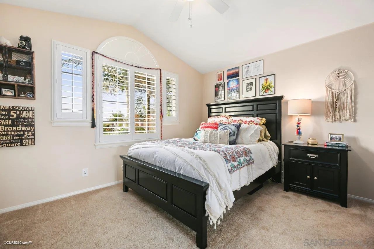 12504 Eclipse Place San Diego, CA 92129 - Photo 35 of 60 a bedroom with a bed and a window