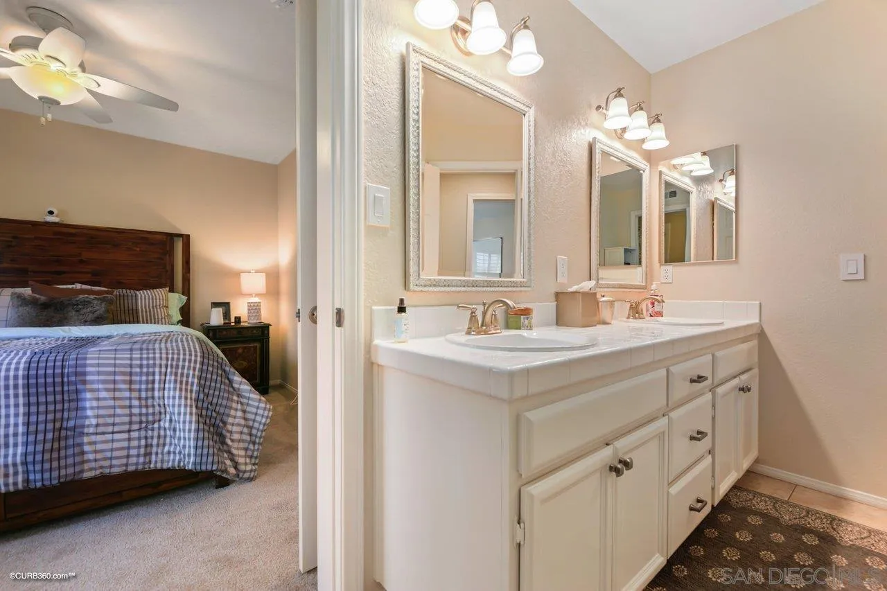 12504 Eclipse Place San Diego, CA 92129 - Photo 36 of 60 a bathroom with a sink double vanity and a mirror