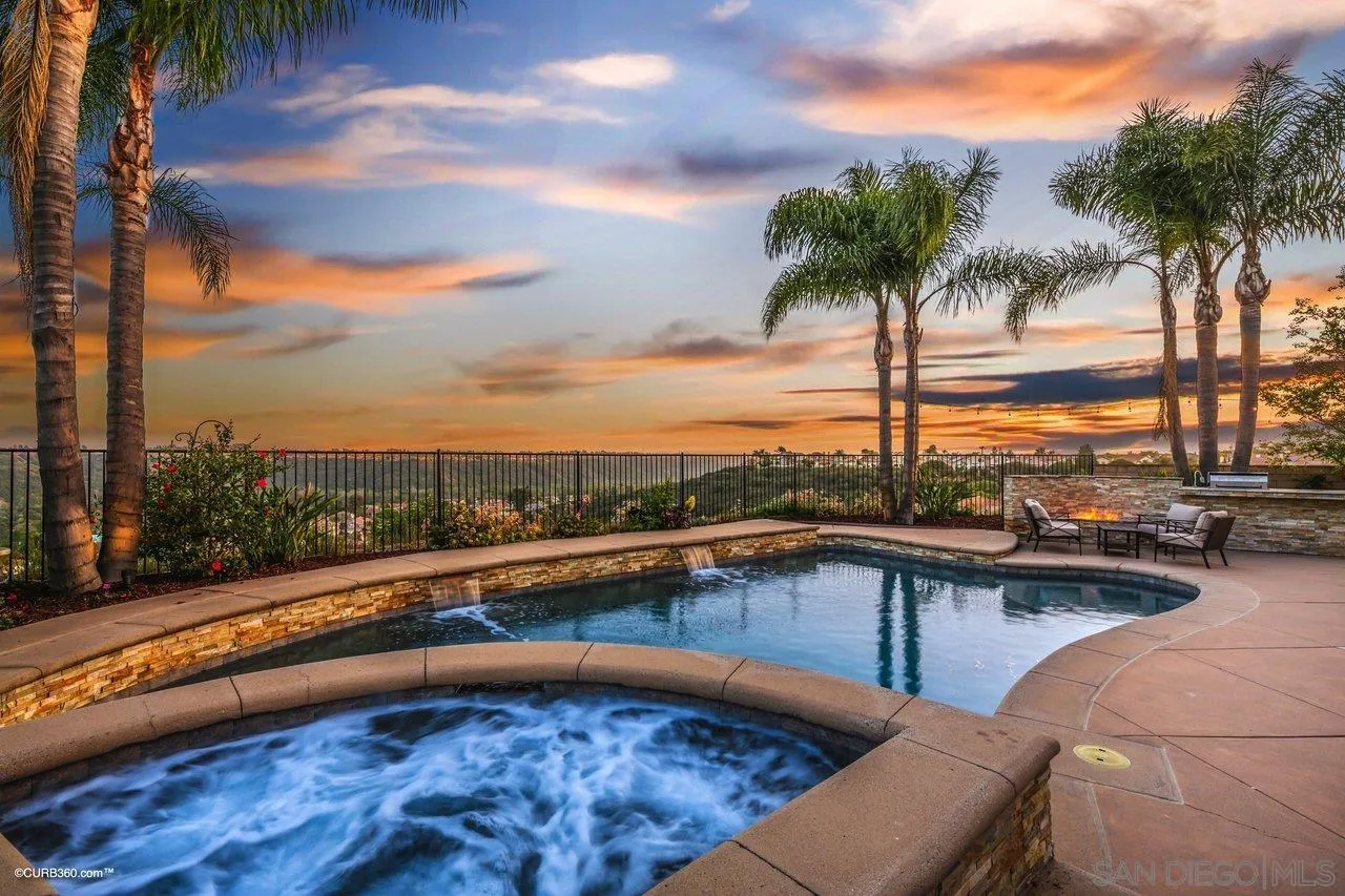 12504 Eclipse Place San Diego, CA 92129 - Photo 4 of 60 a view of a swimming pool and lounge chair