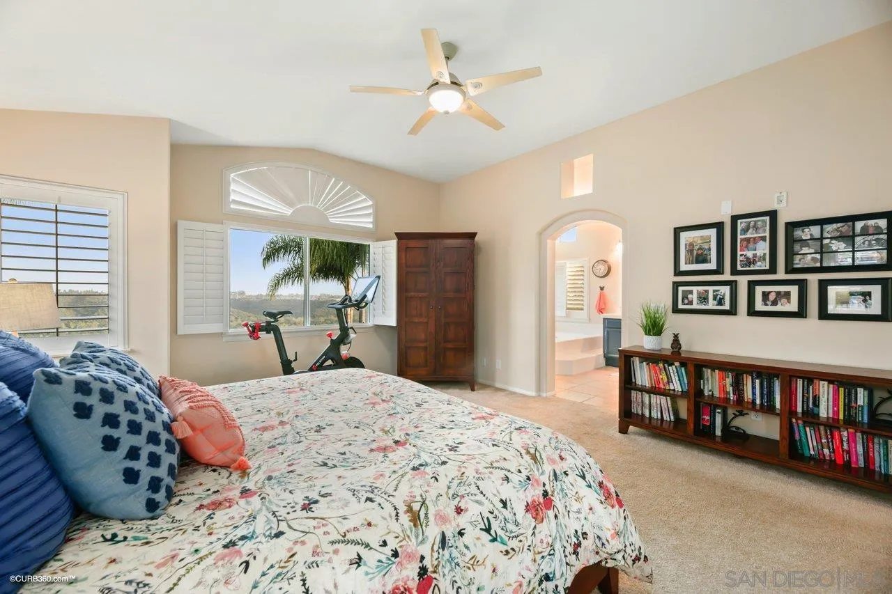 12504 Eclipse Place San Diego, CA 92129 - Photo 44 of 60 a bedroom with a bed furniture and a large window