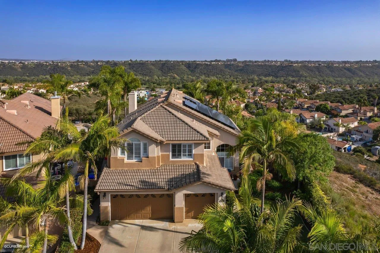12504 Eclipse Place San Diego, CA 92129 - Photo 51 of 60 a view of a house with a yard