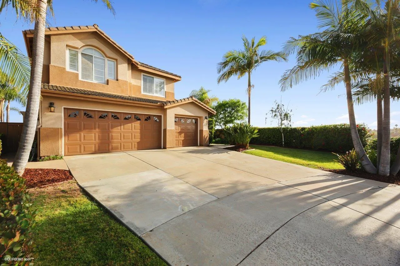 12504 Eclipse Place San Diego, CA 92129 - Photo 9 of 60 a house with palm tree in front of it
