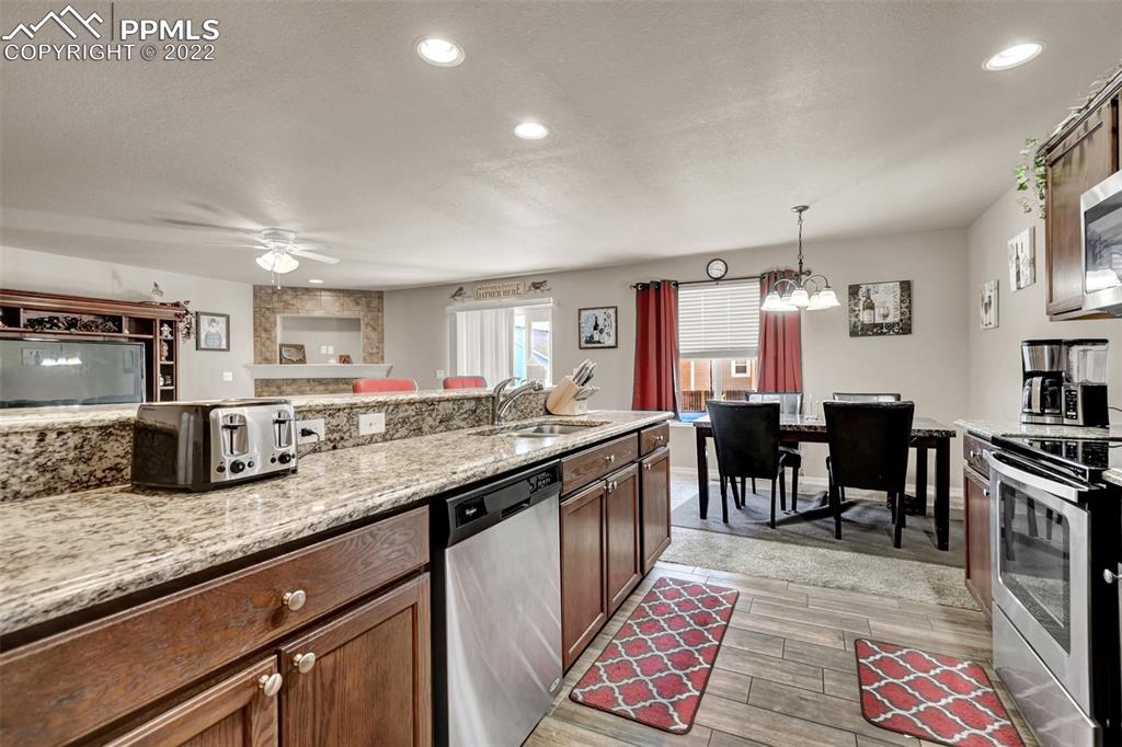 6570 Gelbvieh Road Peyton, CO 80831 - Photo 17 of 38 a large kitchen with lots of counter space