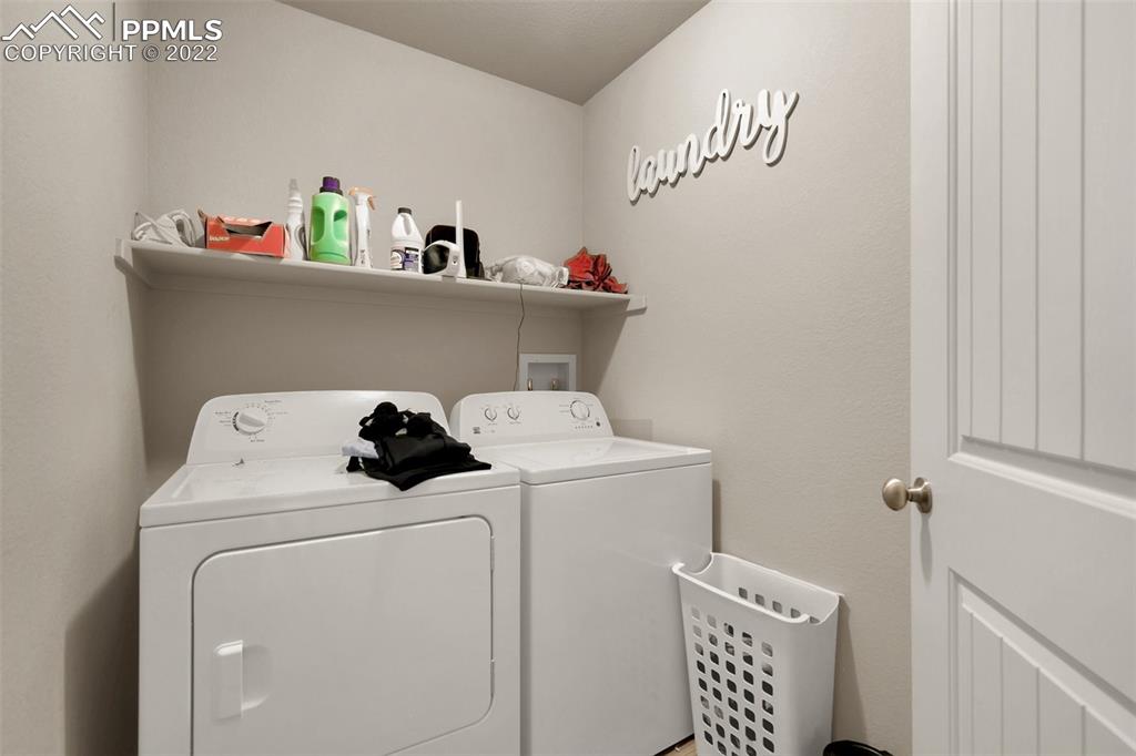6570 Gelbvieh Road Peyton, CO 80831 - Photo 32 of 38 a utility room with dryer and washer